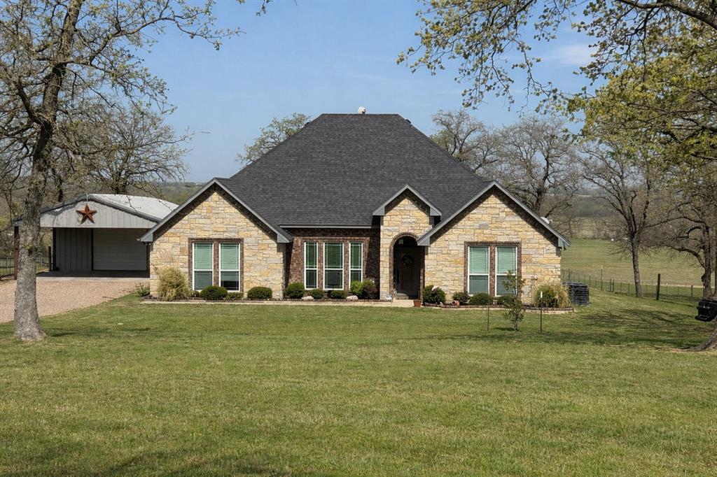 793 County Road 2535 Decatur, TX 76234 - Photo 1 of 39 a front view of a house with a yard