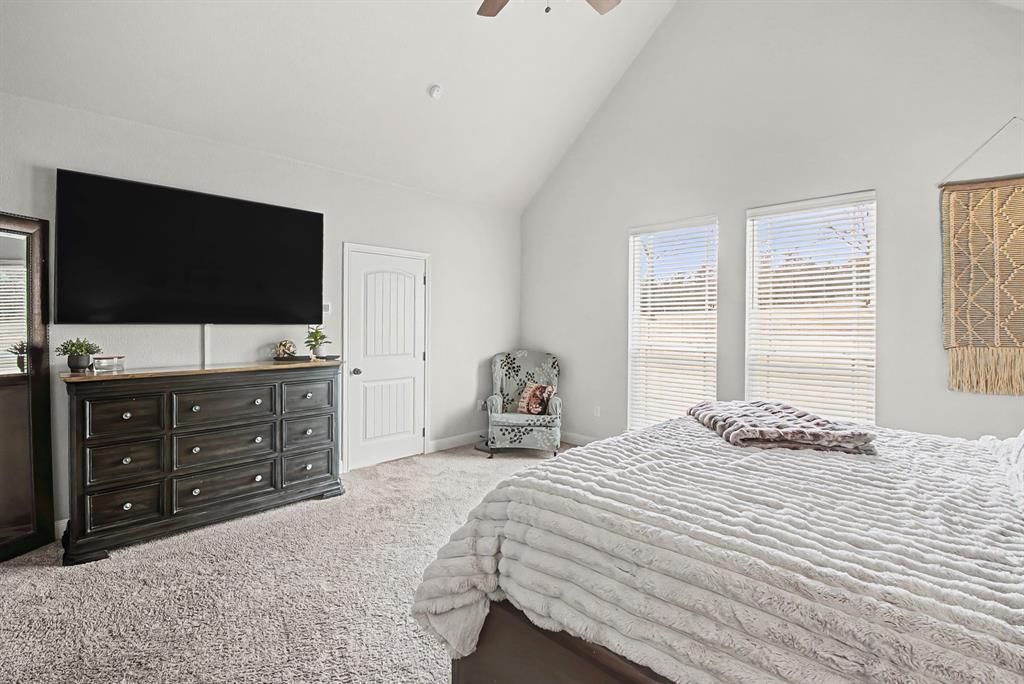 793 County Road 2535 Decatur, TX 76234 - Photo 20 of 39 a bedroom with a bed and a flat screen tv