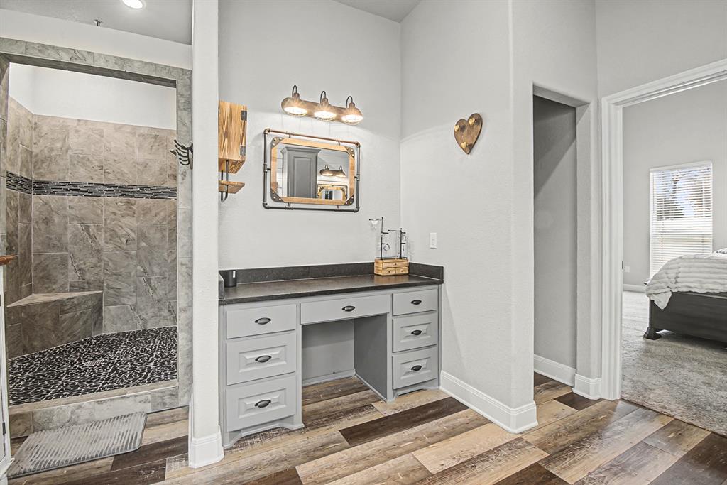793 County Road 2535 Decatur, TX 76234 - Photo 23 of 39 a view of bathroom with a toilet sink and mirror