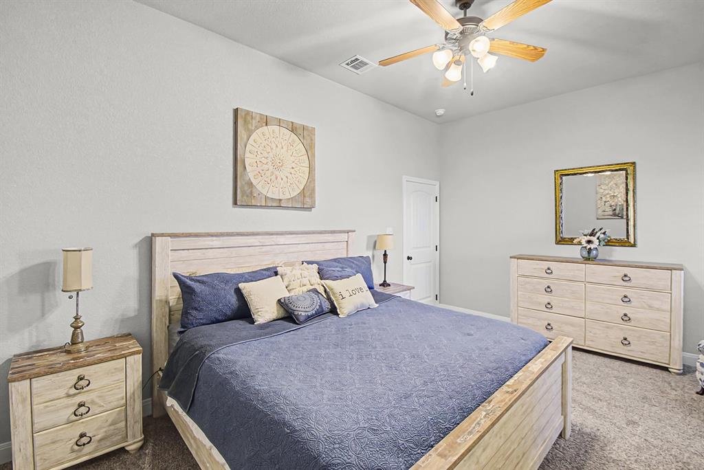 793 County Road 2535 Decatur, TX 76234 - Photo 24 of 39 a bedroom with a bed and a dresser