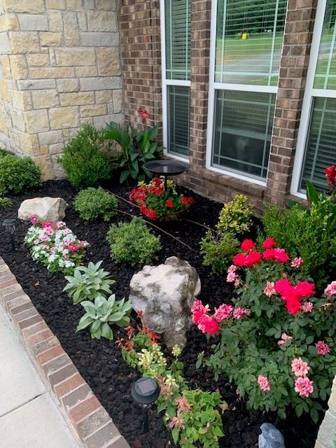 793 County Road 2535 Decatur, TX 76234 - Photo 38 of 39 a view of a flower arrangement in front of a house