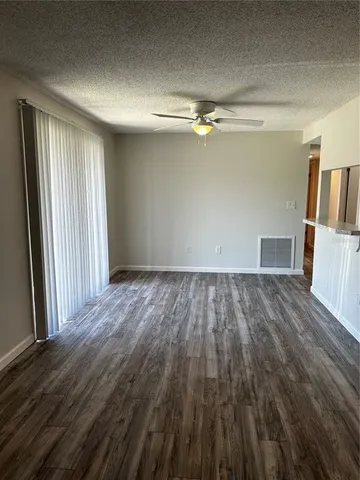 a view of kitchen with wooden floor