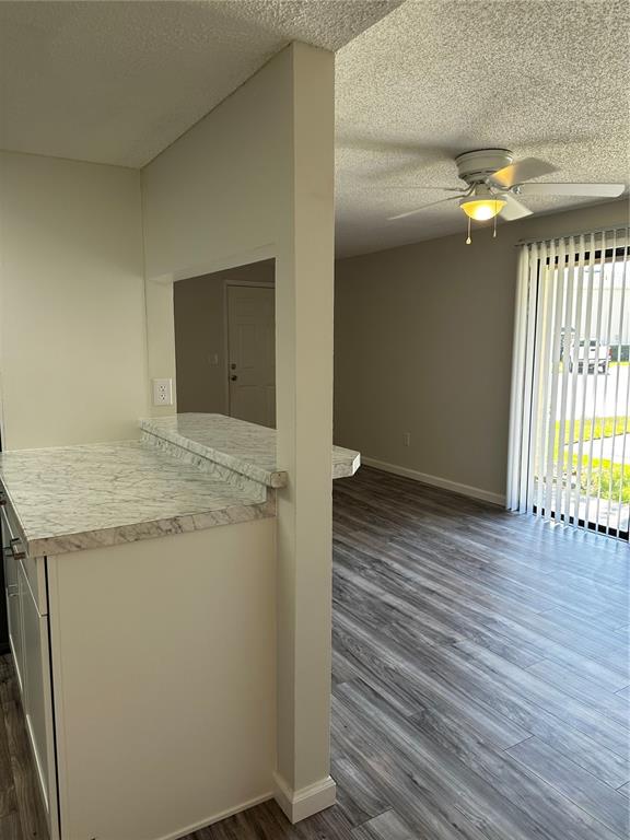 124 Loblolly Court, Unit F Oldsmar, FL 34677 - Photo 21 of 33 an empty room with wooden floor and windows