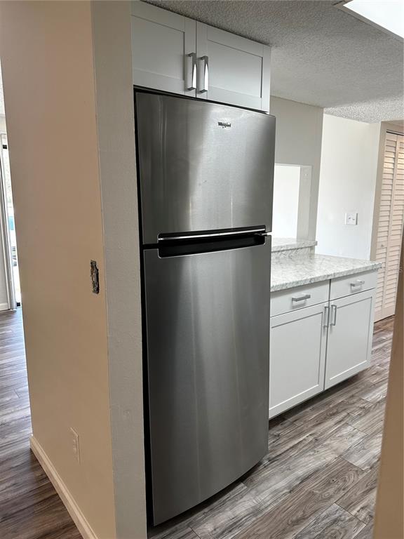124 Loblolly Court, Unit F Oldsmar, FL 34677 - Photo 24 of 33 a white refrigerator freezer sitting in a kitchen