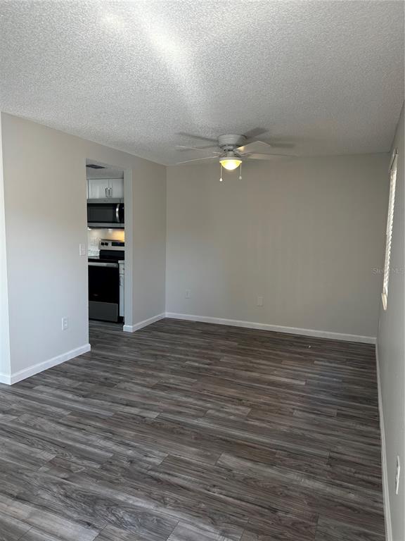 124 Loblolly Court, Unit F Oldsmar, FL 34677 - Photo 28 of 33 a view of empty room with wooden floor
