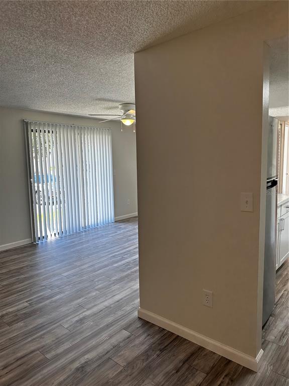 124 Loblolly Court, Unit F Oldsmar, FL 34677 - Photo 32 of 33 a view of a livingroom with wooden floor