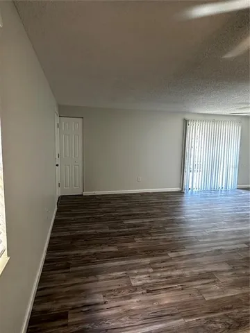 a view of a livingroom with wooden floor