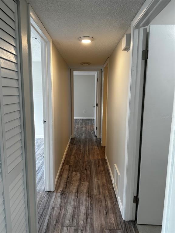 124 Loblolly Court, Unit F Oldsmar, FL 34677 - Photo 9 of 33 a view of a hallway with wooden floor and staircase