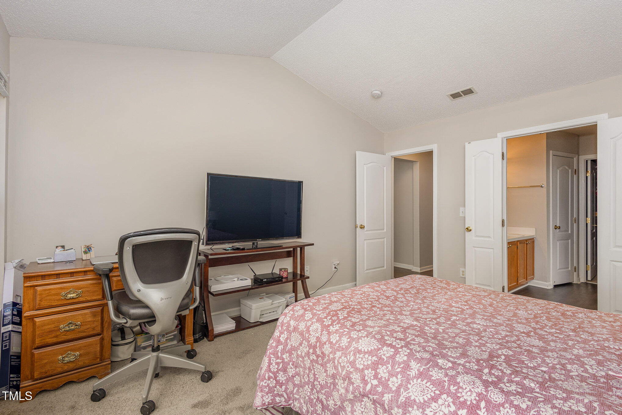 4331 Crowfield Drive Raleigh, NC 27610 - Photo 16 of 26 a bedroom with a bed and chair