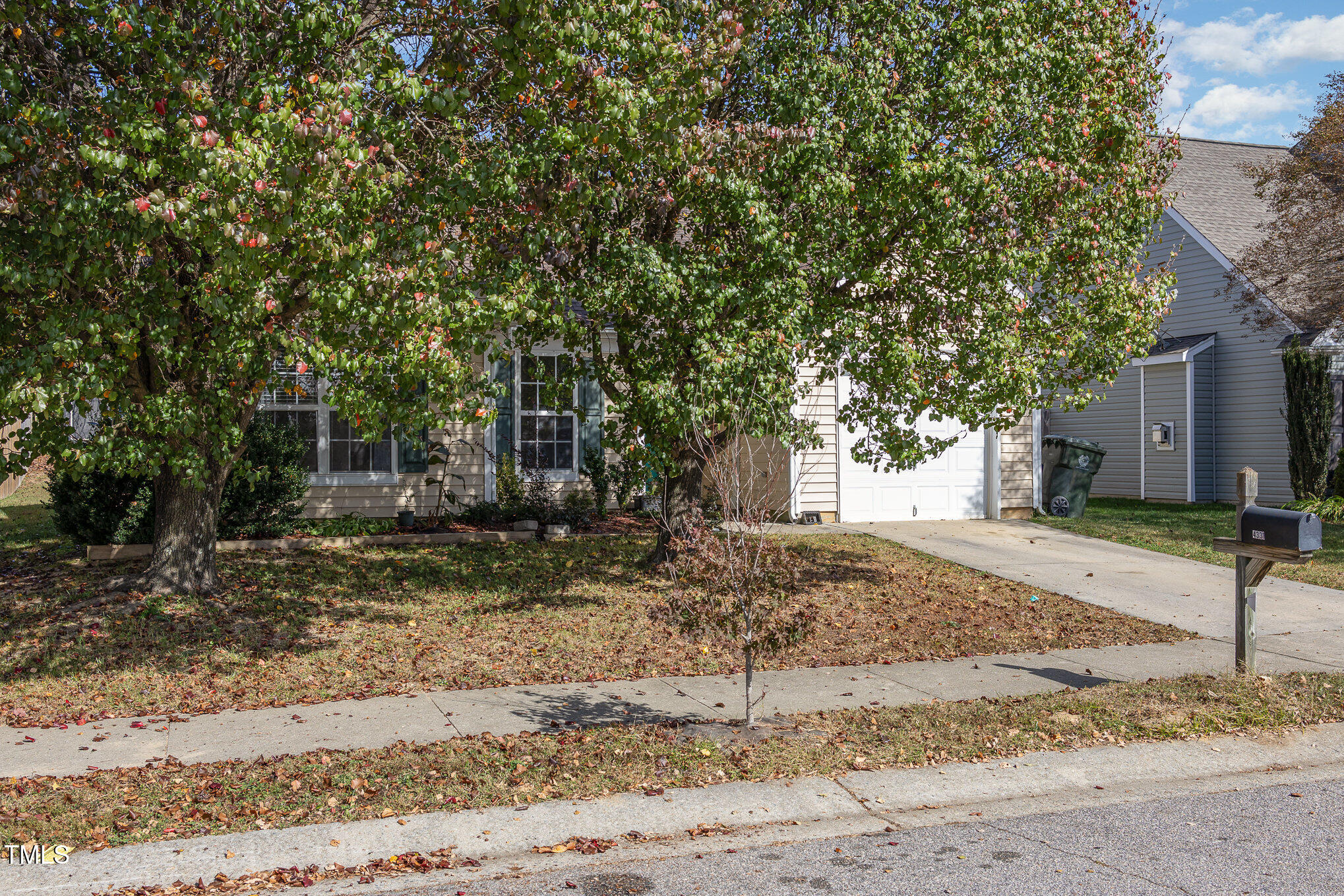 4331 Crowfield Drive Raleigh, NC 27610 - Photo 2 of 26 a tree in front of a white house