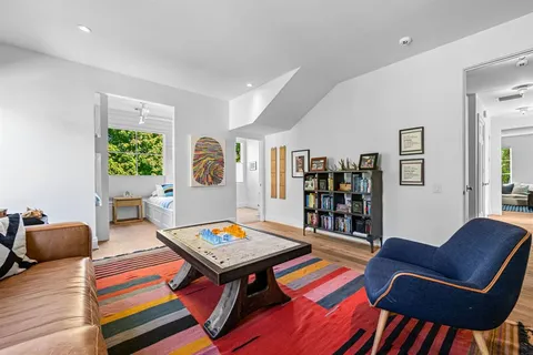 a living room with furniture and a rug