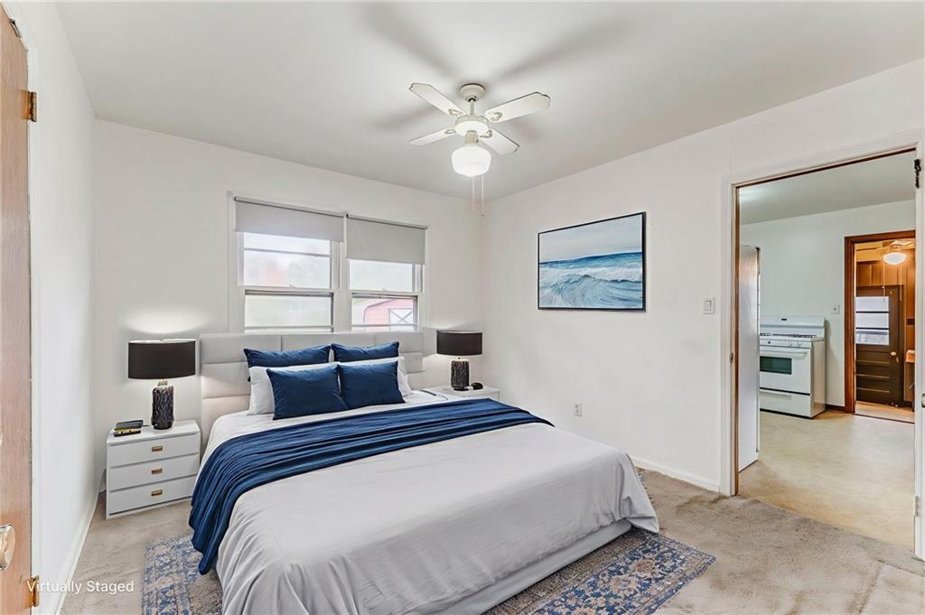 6 Don Drive Northeast Rome, GA 30165 - Photo 15 of 42 a bedroom with a large bed and a chandelier