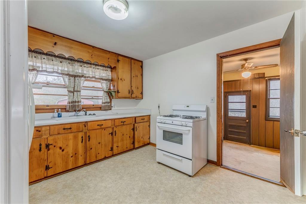 6 Don Drive Northeast Rome, GA 30165 - Photo 18 of 42 a kitchen with granite countertop a sink and a stove top oven