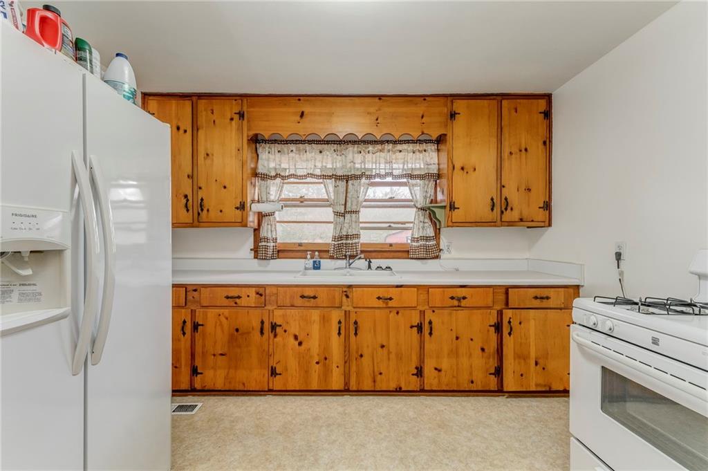 6 Don Drive Northeast Rome, GA 30165 - Photo 21 of 42 a kitchen with stainless steel appliances granite countertop a stove and a refrigerator
