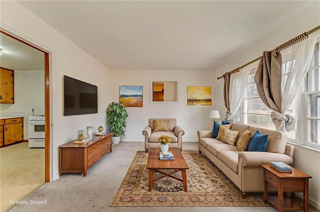 6 Don Drive Northeast Rome, GA 30165 - Photo 30 of 42 a living room with furniture a flat screen tv and a window