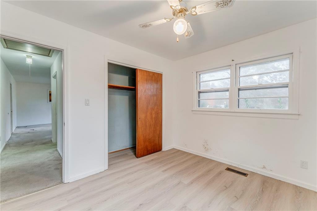 6 Don Drive Northeast Rome, GA 30165 - Photo 8 of 42 an empty room with wooden floor closet and windows