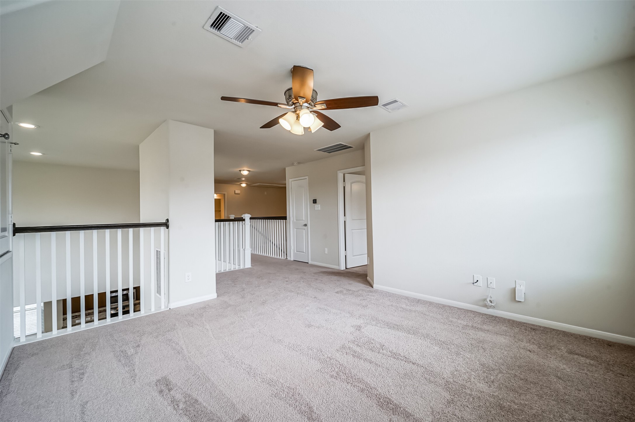 10003 Open Slope Court Humble, TX 77396 - Photo 10 of 25 The gameroom is spacious and features a lighted ceiling fan.