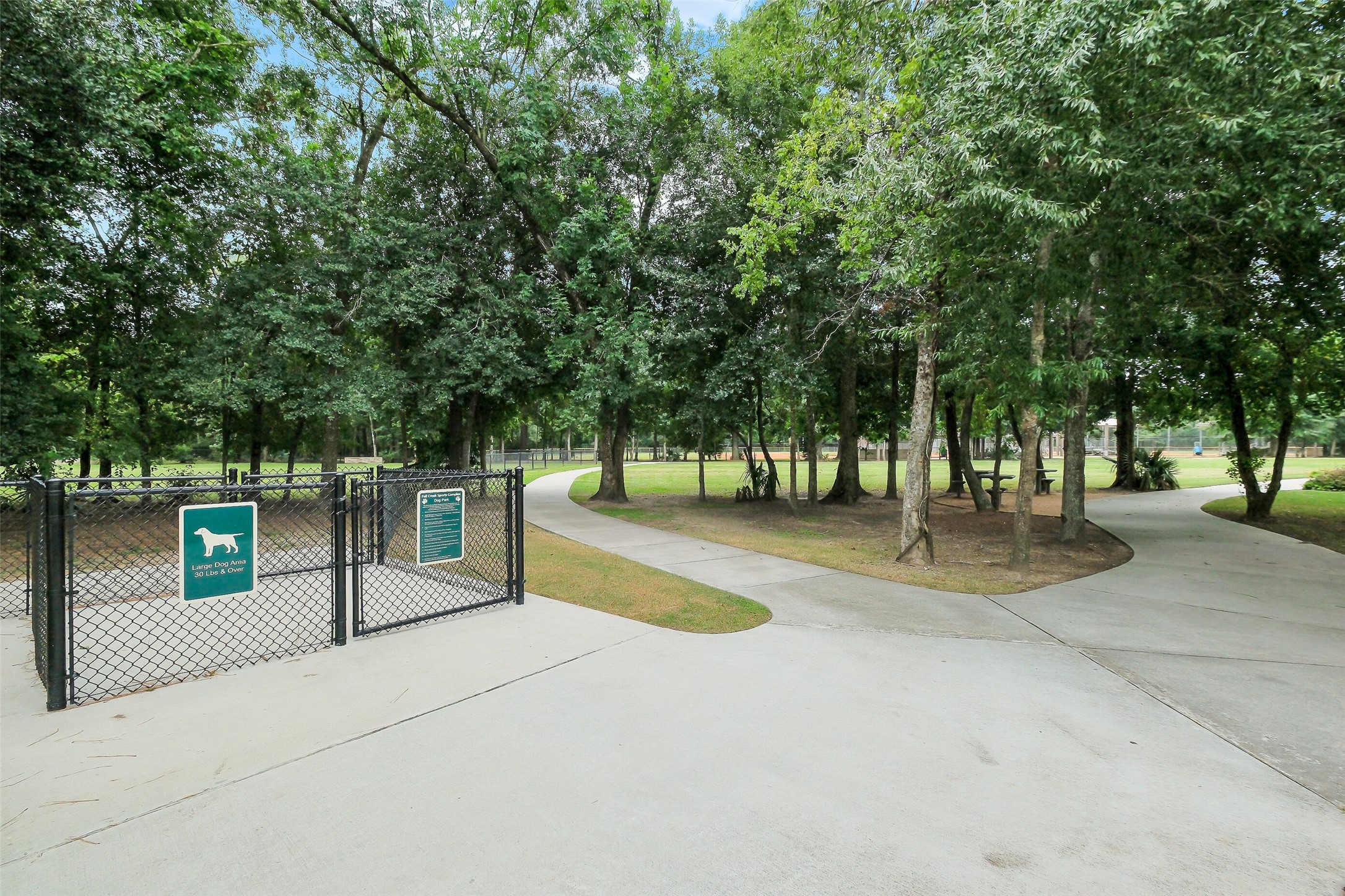 10003 Open Slope Court Humble, TX 77396 - Photo 20 of 25 Fall Creek is home to so many amenities! This sports park and dog park is located just 5 minutes from the house. With sand volleyball, baseball, basketball, a park, trails and a dog run, everyone will find something they love here!