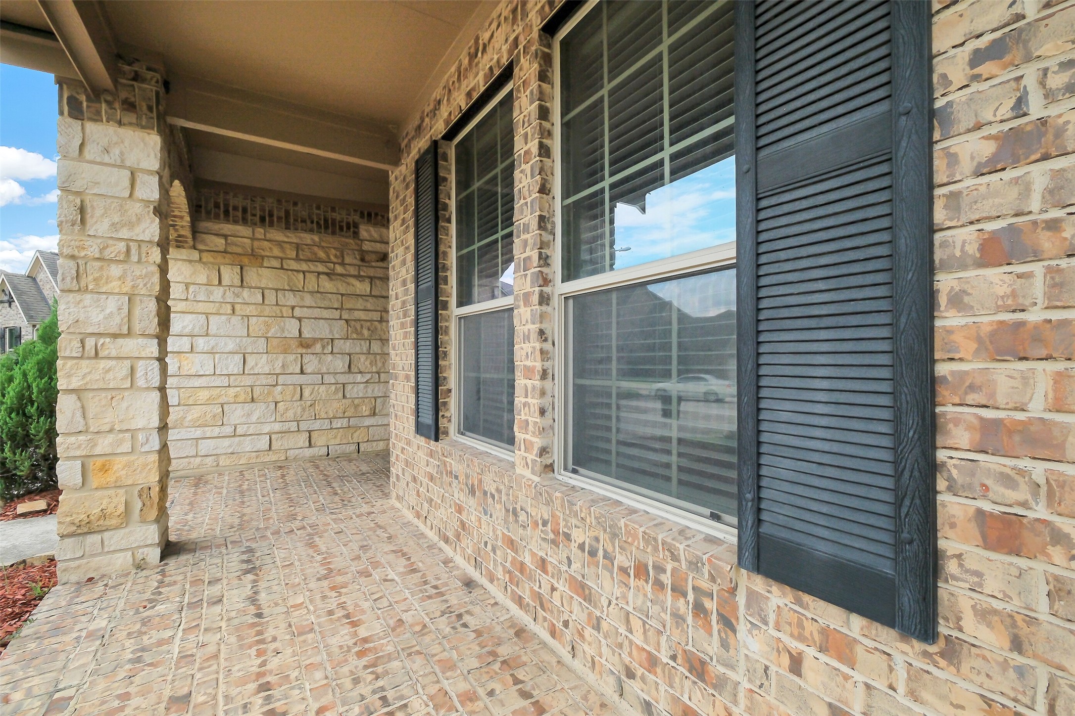 10003 Open Slope Court Humble, TX 77396 - Photo 23 of 25 Who doesn't love a front porch? Add some chairs and plants and you'll be the envy of the cul-de-sac. Welcome home!