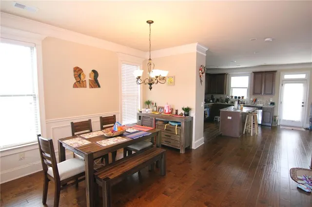 a dining room with furniture window wooden floor