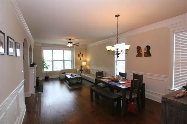 a large bed sitting in a bedroom next to a window