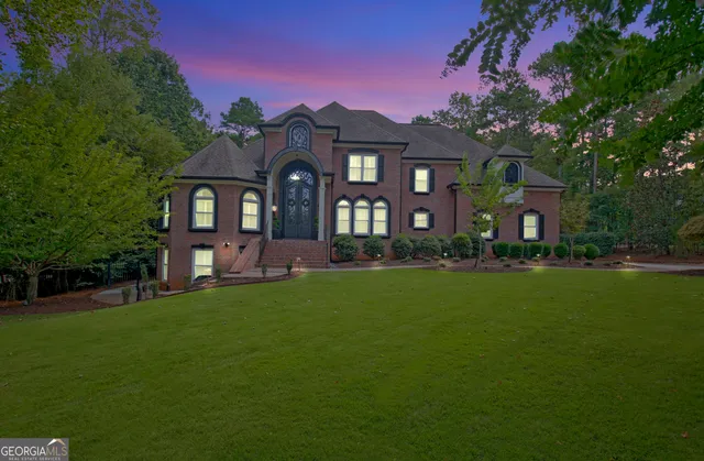 an aerial view of a house with outdoor space pool seating area and yard