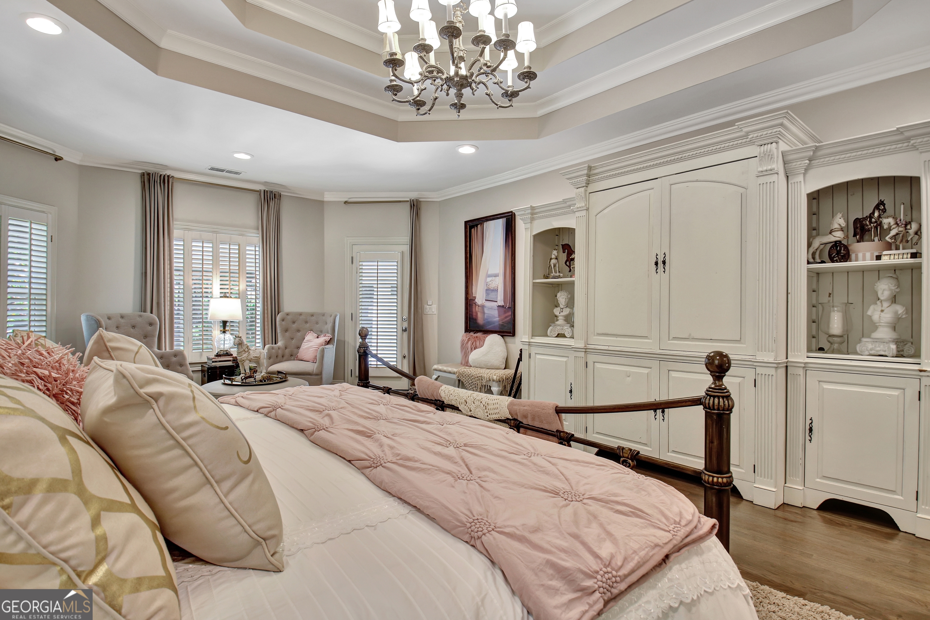804 Ridgestone Court Peachtree City, GA 30269 - Photo 37 of 83 a bedroom with a bed and a chandelier