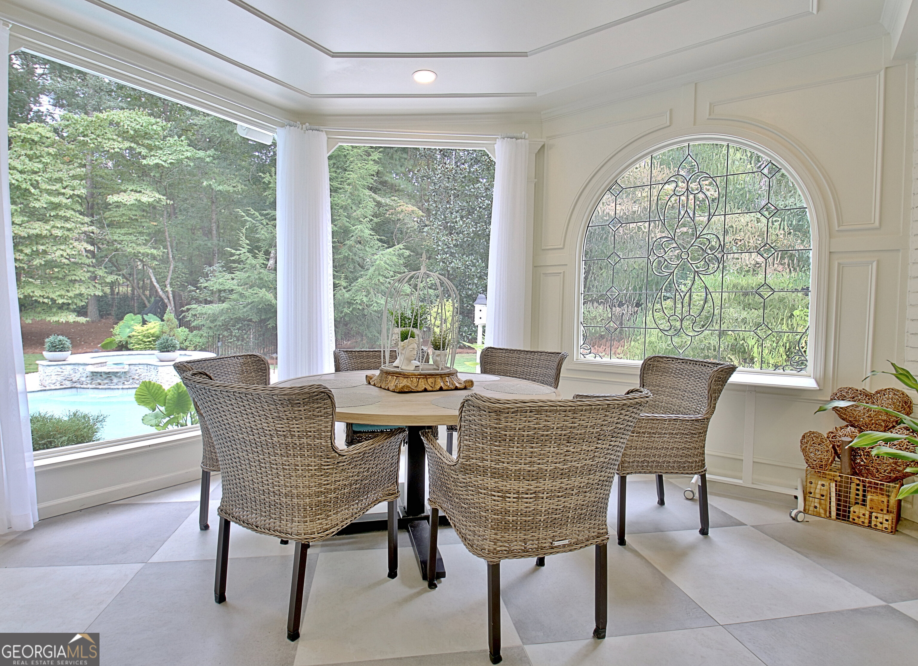 804 Ridgestone Court Peachtree City, GA 30269 - Photo 46 of 83 a dining room with furniture a rug and a large window
