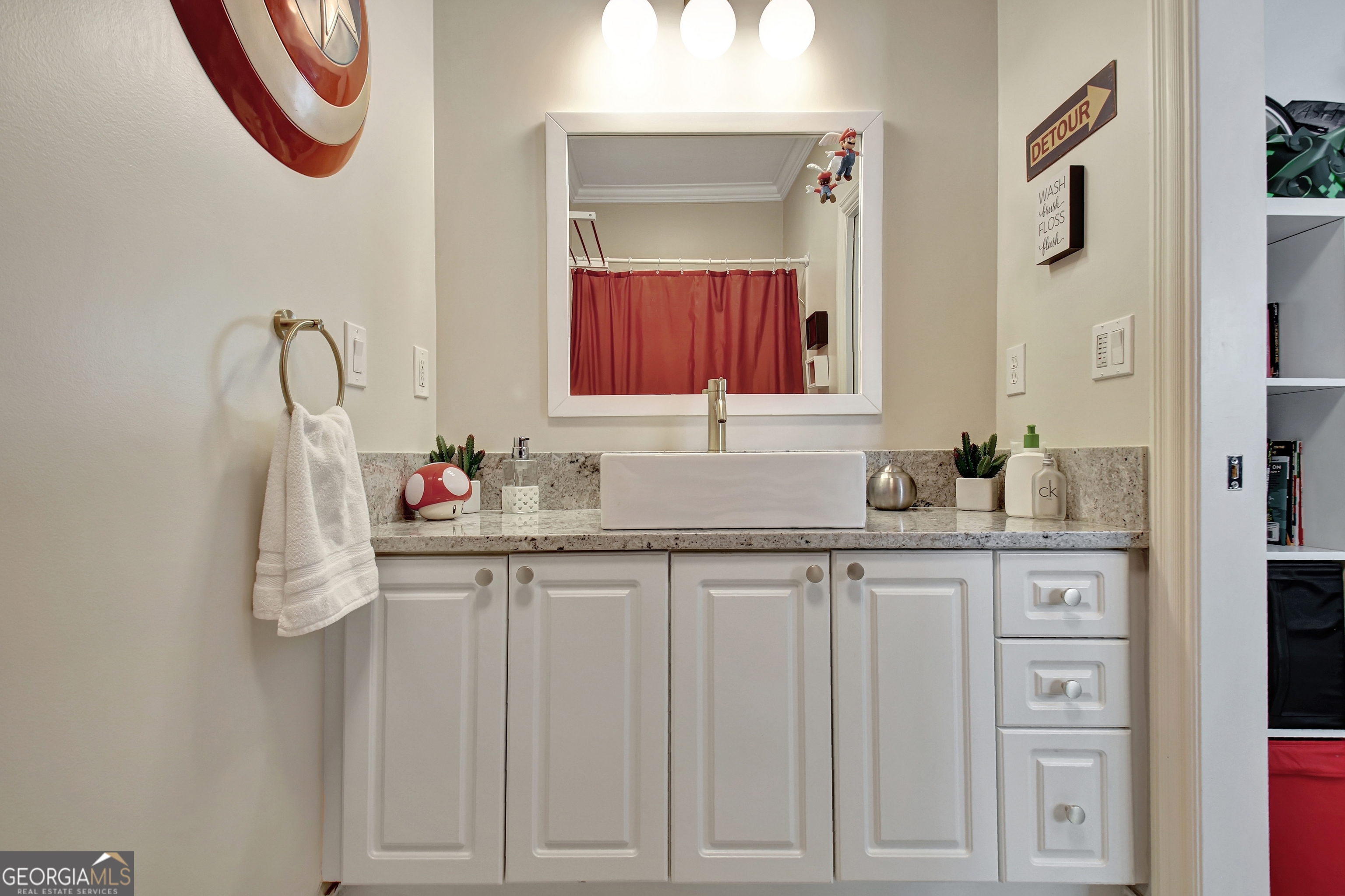 804 Ridgestone Court Peachtree City, GA 30269 - Photo 53 of 83 a bathroom with a sink and a mirror