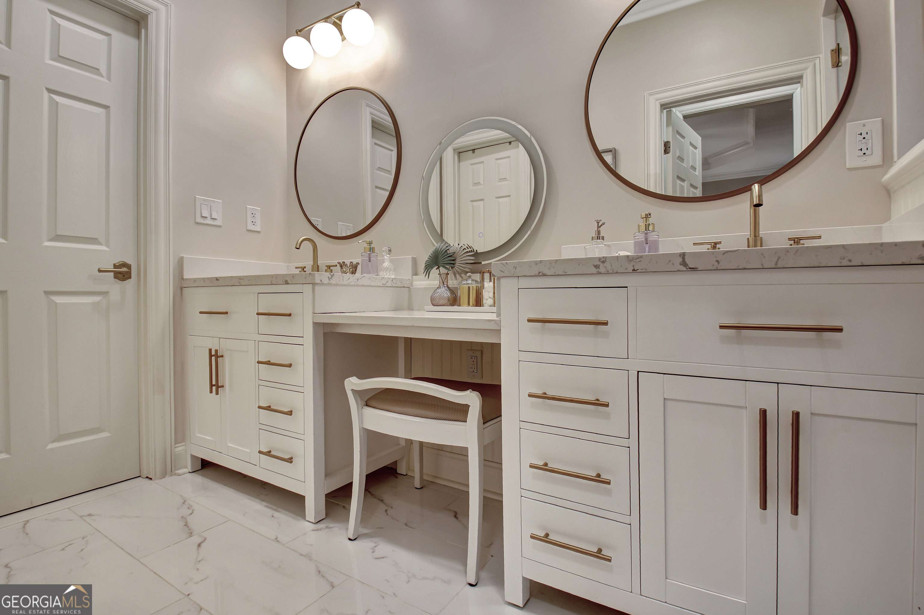 804 Ridgestone Court Peachtree City, GA 30269 - Photo 56 of 83 a bathroom with a double vanity sink and a mirror