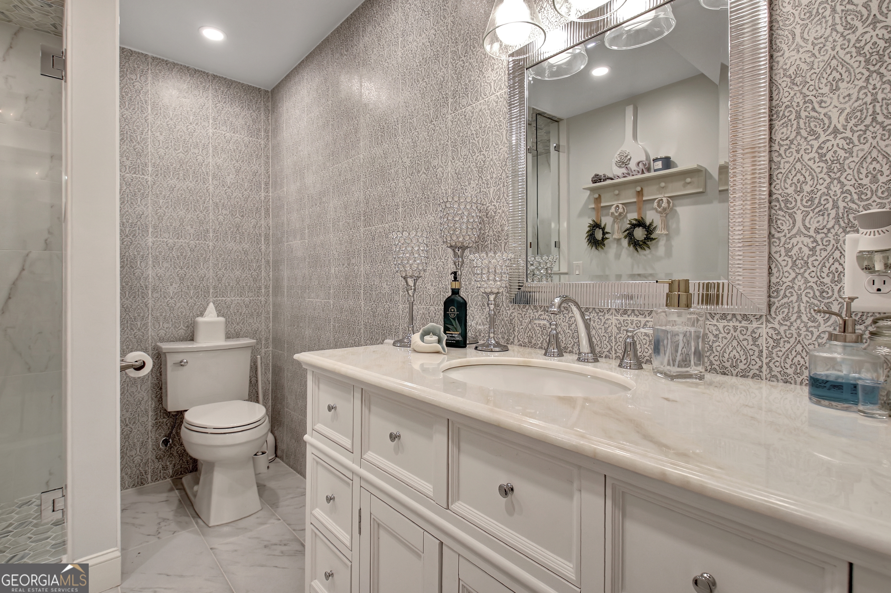 804 Ridgestone Court Peachtree City, GA 30269 - Photo 67 of 83 a bathroom with a sink a toilet and a mirror