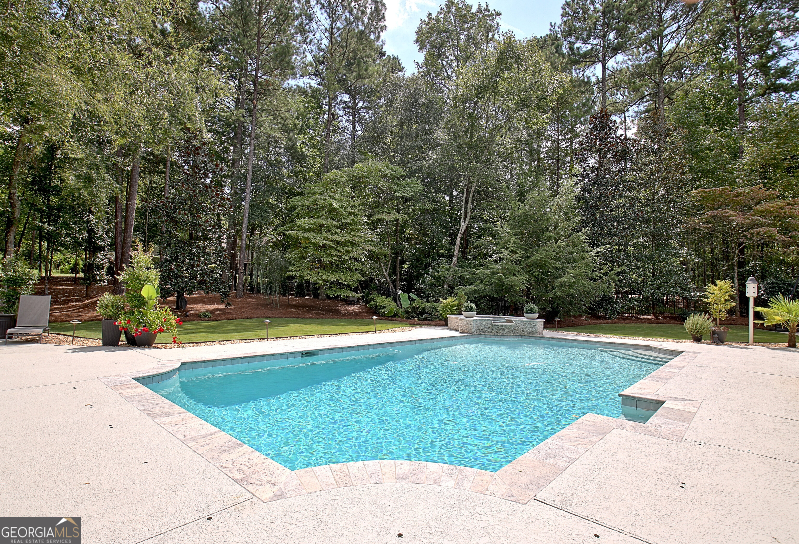 804 Ridgestone Court Peachtree City, GA 30269 - Photo 69 of 83 a view of a swimming pool with an outdoor space and seating area