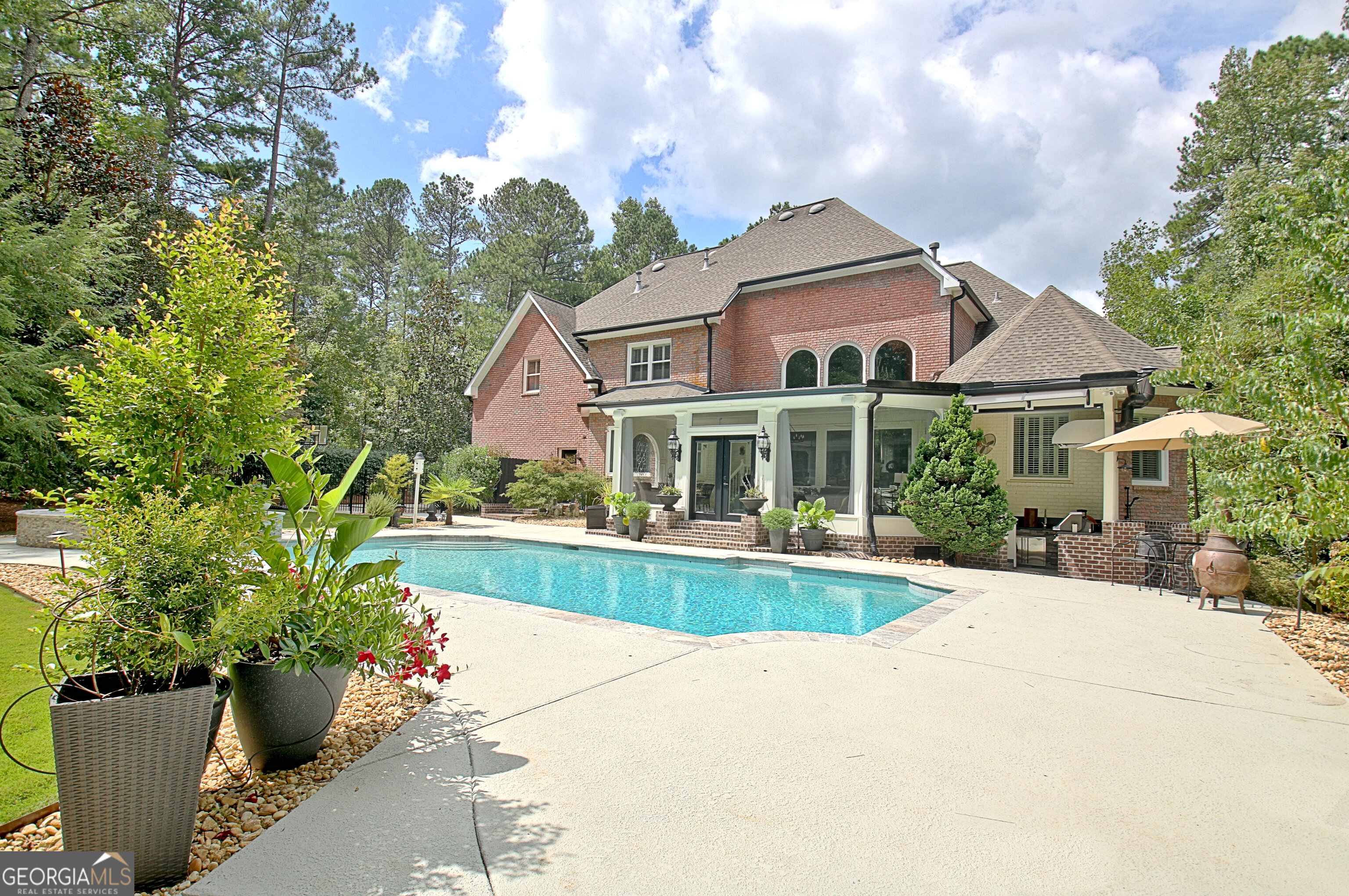 804 Ridgestone Court Peachtree City, GA 30269 - Photo 76 of 83 a front view of a house with a yard and potted plants
