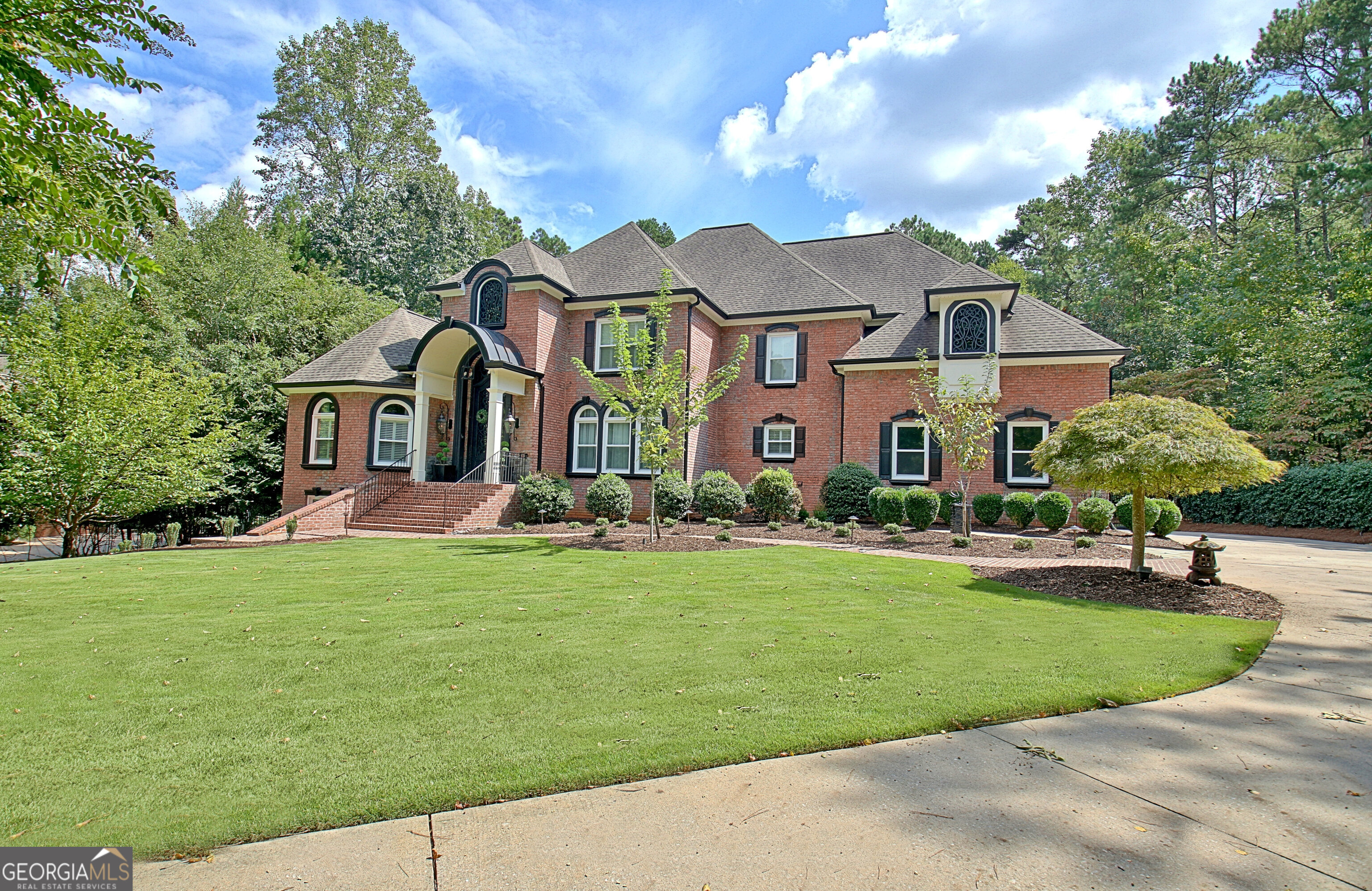 804 Ridgestone Court Peachtree City, GA 30269 - Photo 8 of 83 a front view of house with yard and green space