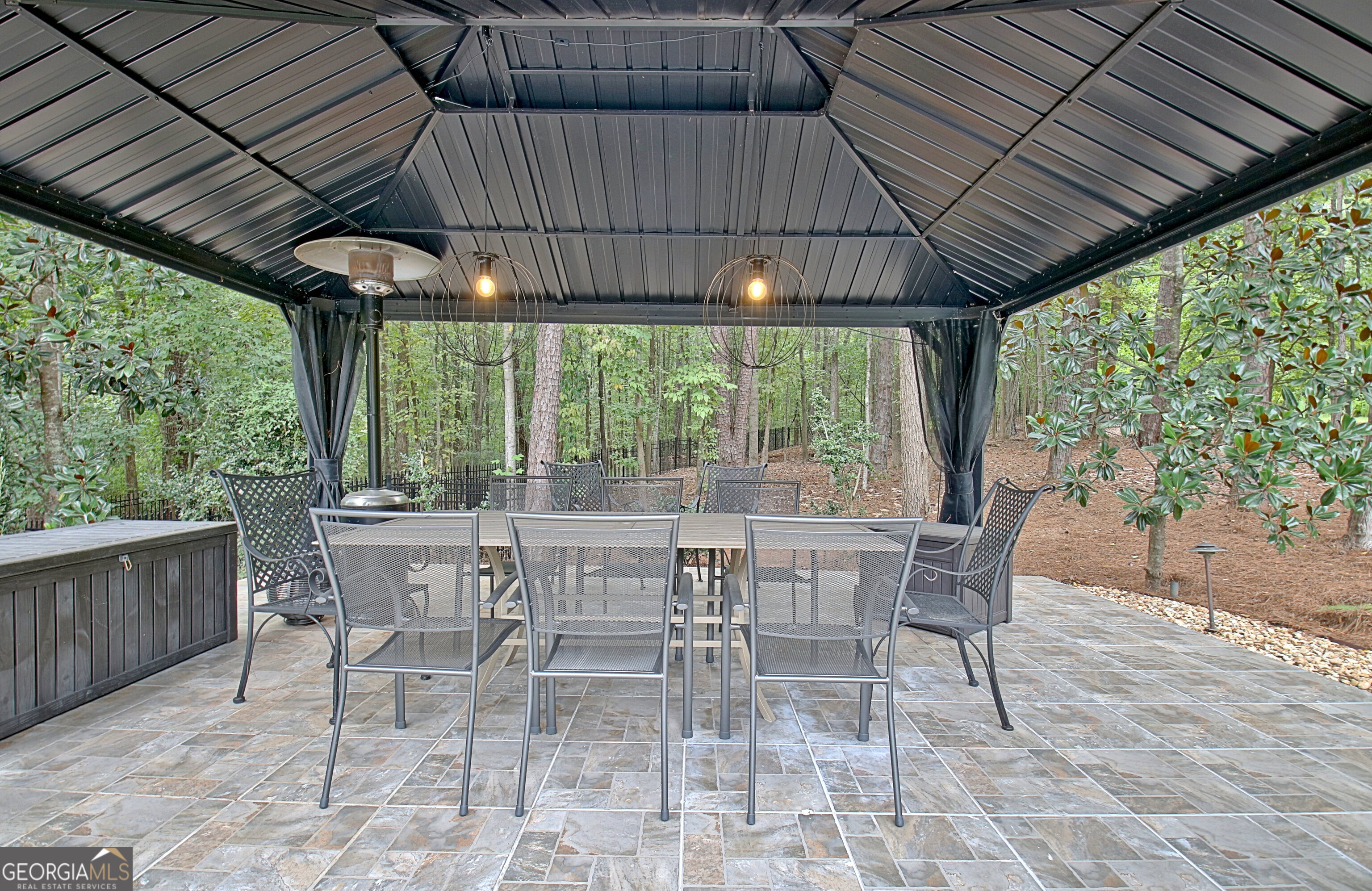804 Ridgestone Court Peachtree City, GA 30269 - Photo 81 of 83 a patio with table and chairs and couches under an umbrella with a barbeque