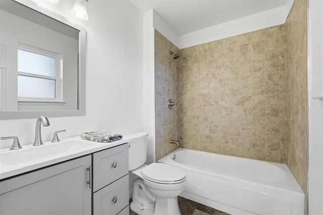 a bathroom with a sink a toilet and a bathtub