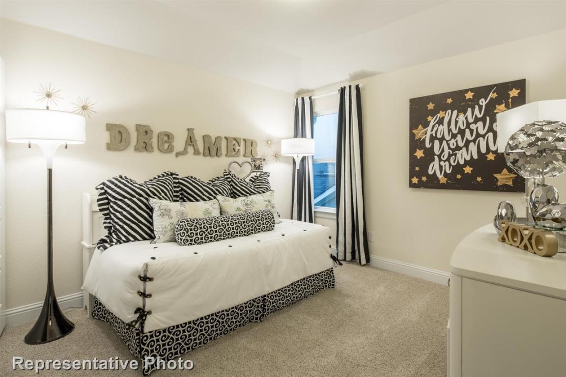 164 Linnet Lane Maxwell, TX 78656 - Photo 33 of 40 a bedroom with a bed and a couch