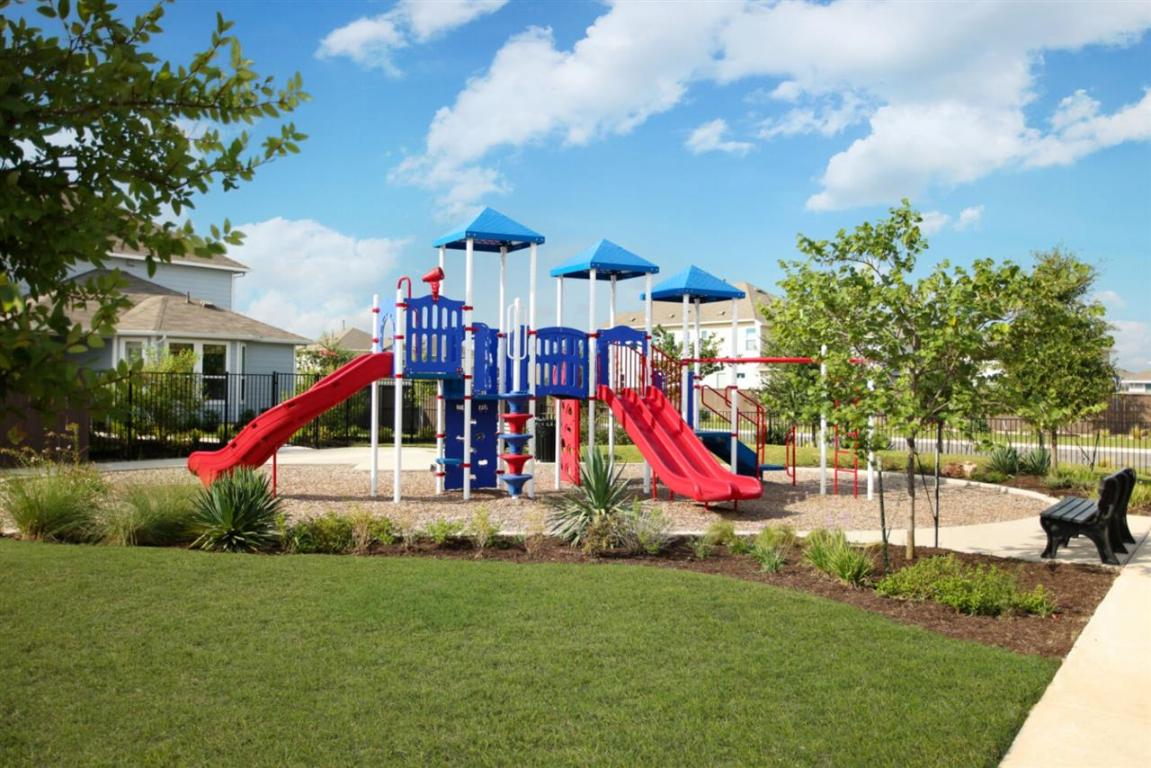 164 Linnet Lane Maxwell, TX 78656 - Photo 39 of 40 a view of a park with large trees and playing ground