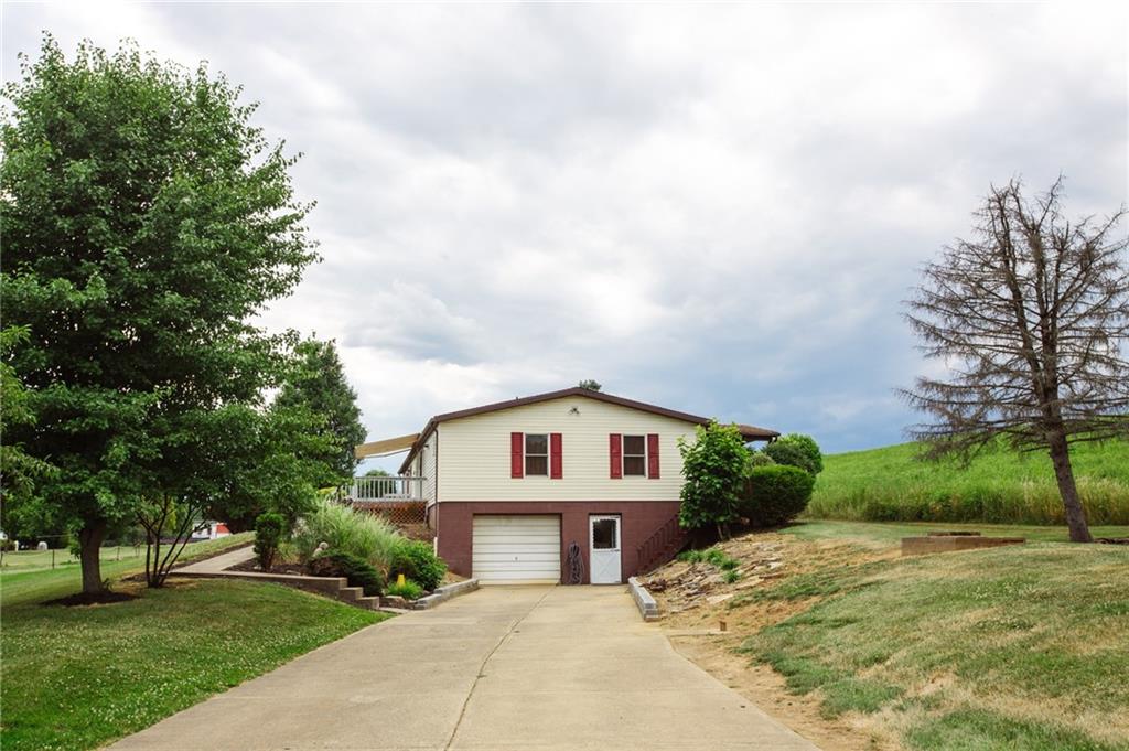 250 Anderson Road Butler, PA 16002 - Photo 1 of 14 a view of white house with a big yard and a large tree