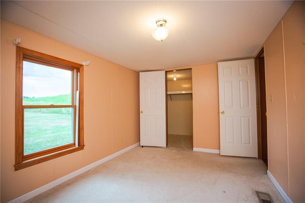250 Anderson Road Butler, PA 16002 - Photo 9 of 14 an empty room with windows and closet