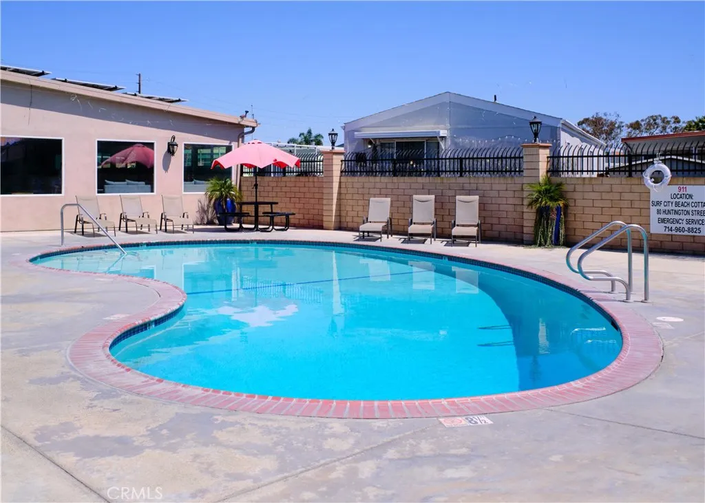 80 Huntington Street, Unit 707 Huntington Beach, CA 92648 - Photo 16 of 16 a view of a swimming pool with a chair