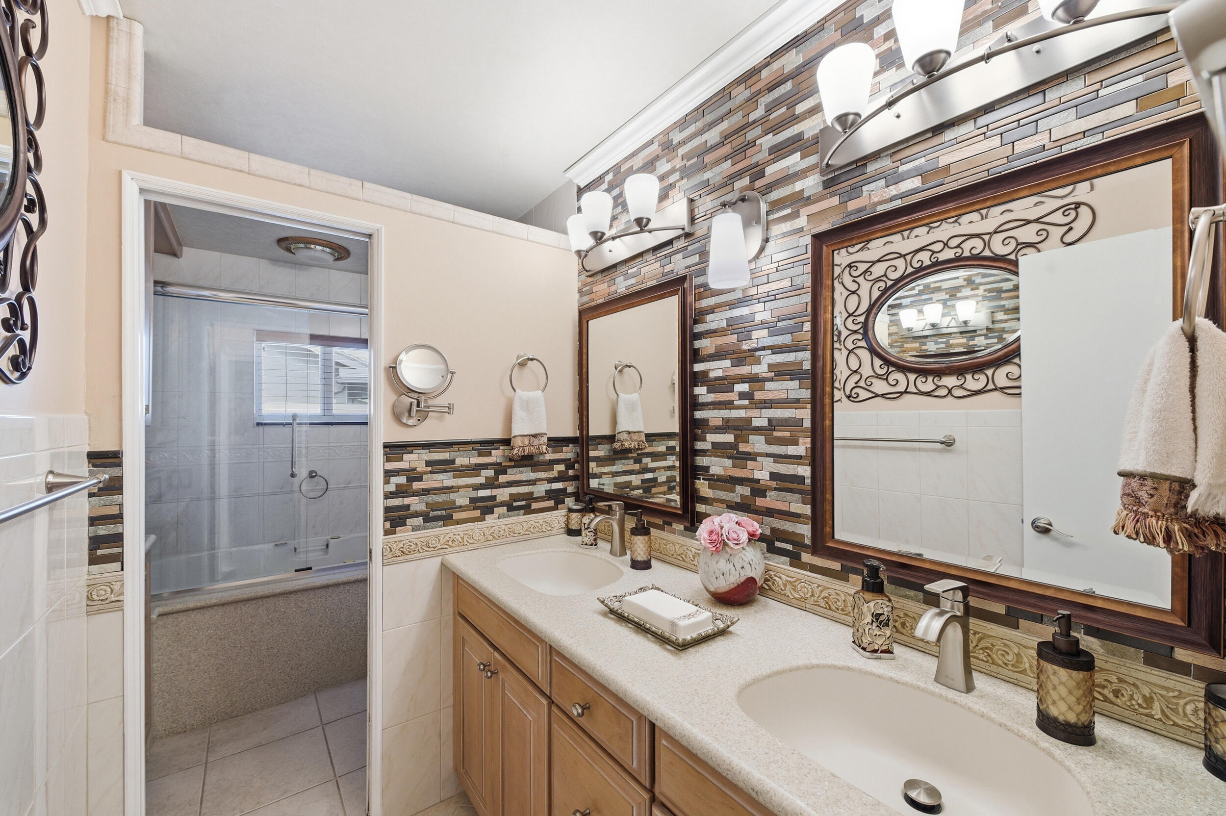 4780 Brandywine Drive Boca Raton, FL 33487 - Photo 19 of 43 a bathroom with a sink double vanity and a mirror