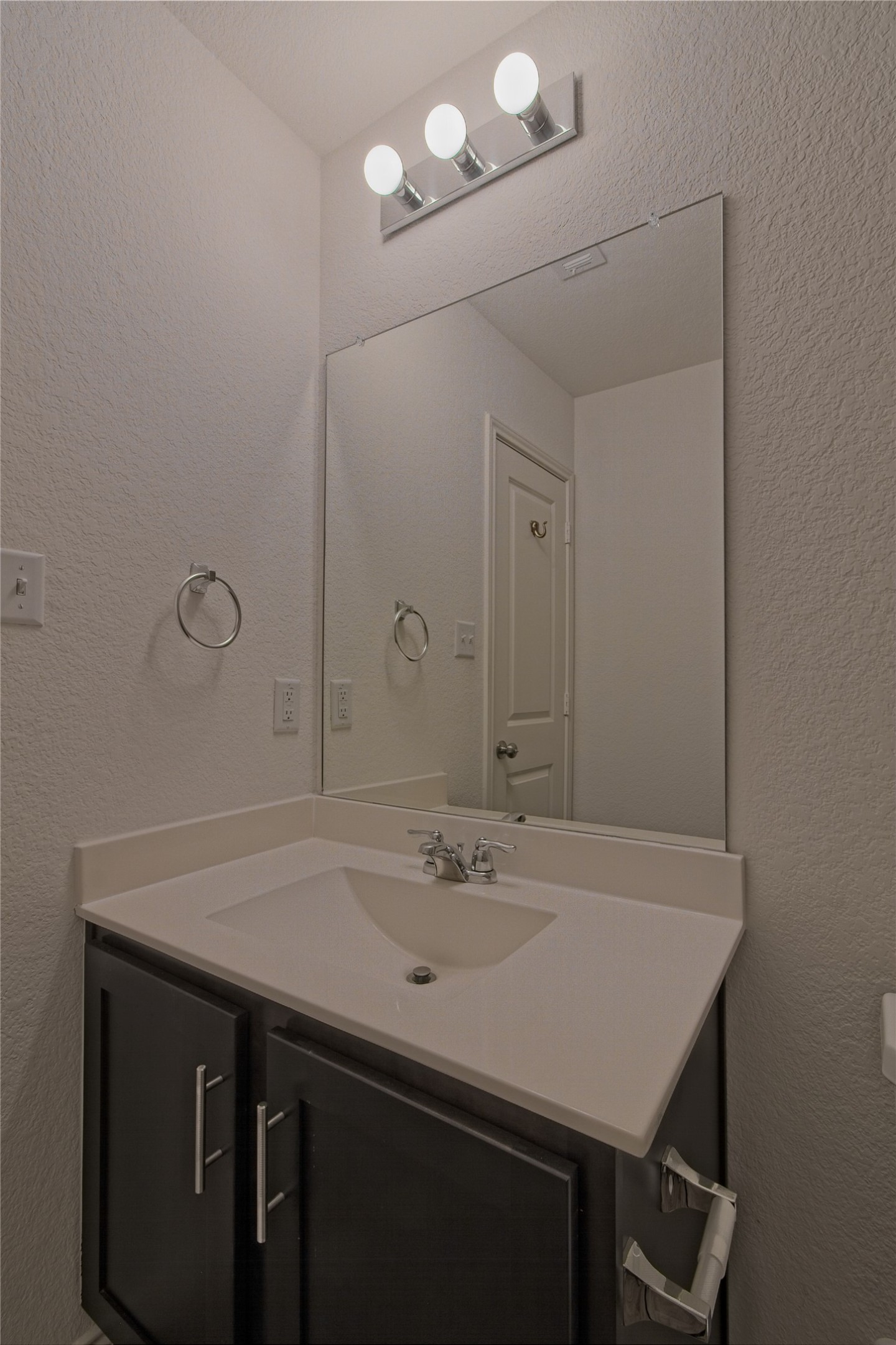 505 Greatest Gift Way Jarrell, TX 76537 - Photo 21 of 30 Bathroom featuring a textured wall and vanity