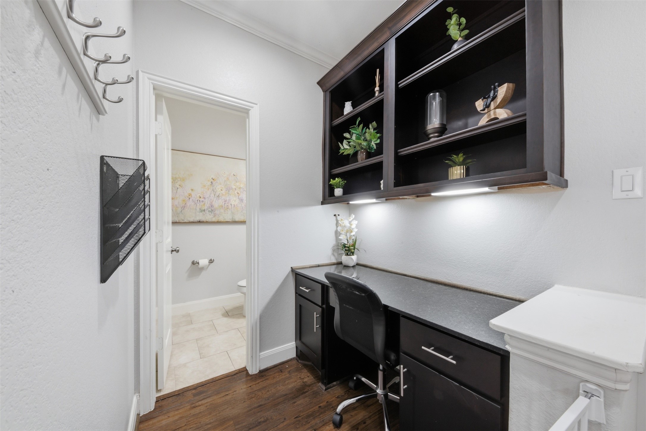 706 Water Street Webster, TX 77598 - Photo 5 of 23 A tucked-away workspace makes it easy to stay productive without sacrificing style. Plus a well-placed powder bath adds convenience for guests and everyday living.