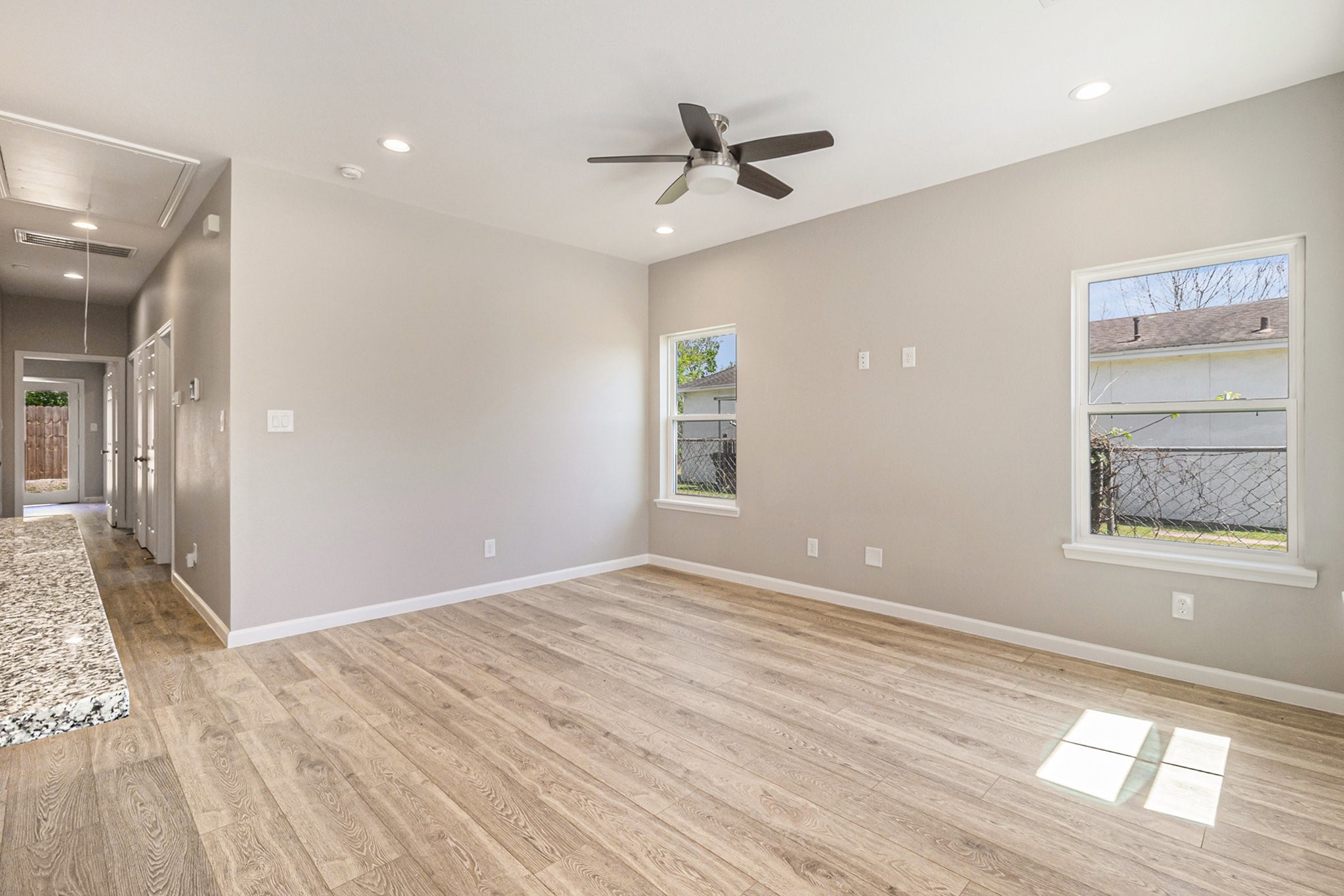 4645 Larkspur Street Houston, TX 77051 - Photo 5 of 16 a view of an empty room with window and wooden floor
