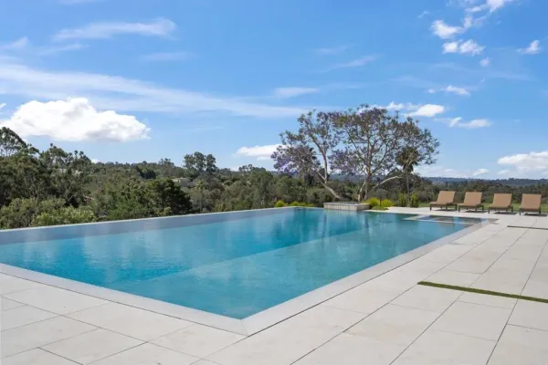 a view of swimming pool from a balcony