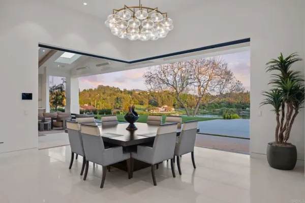 a view of a dining room with furniture window and outside view