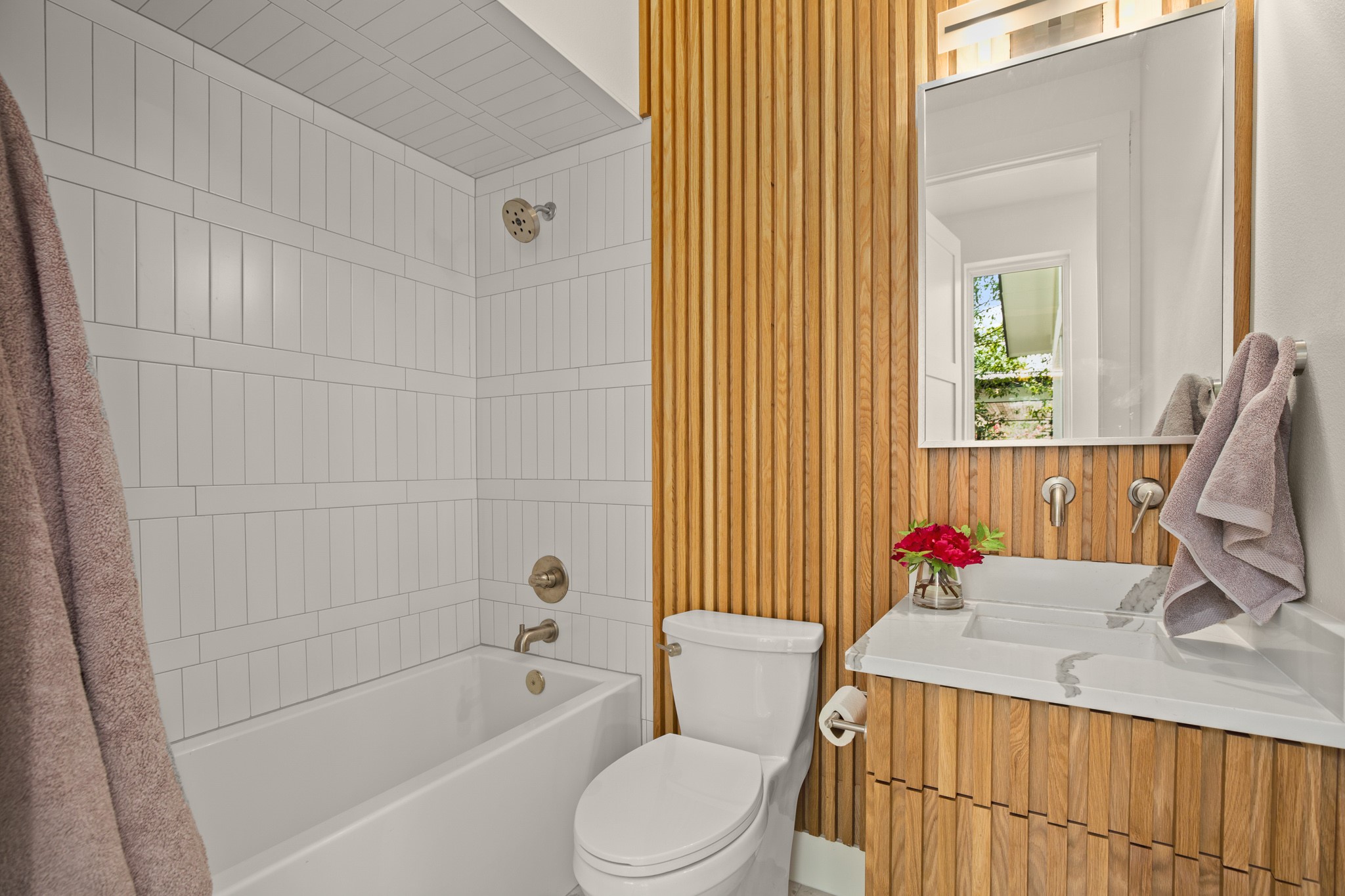 3003 Ray Wood Drive, Unit 2 Austin, TX 78704 - Photo 17 of 28 Full bath featuring vanity, shower / bath combo with shower curtain, and wooden walls