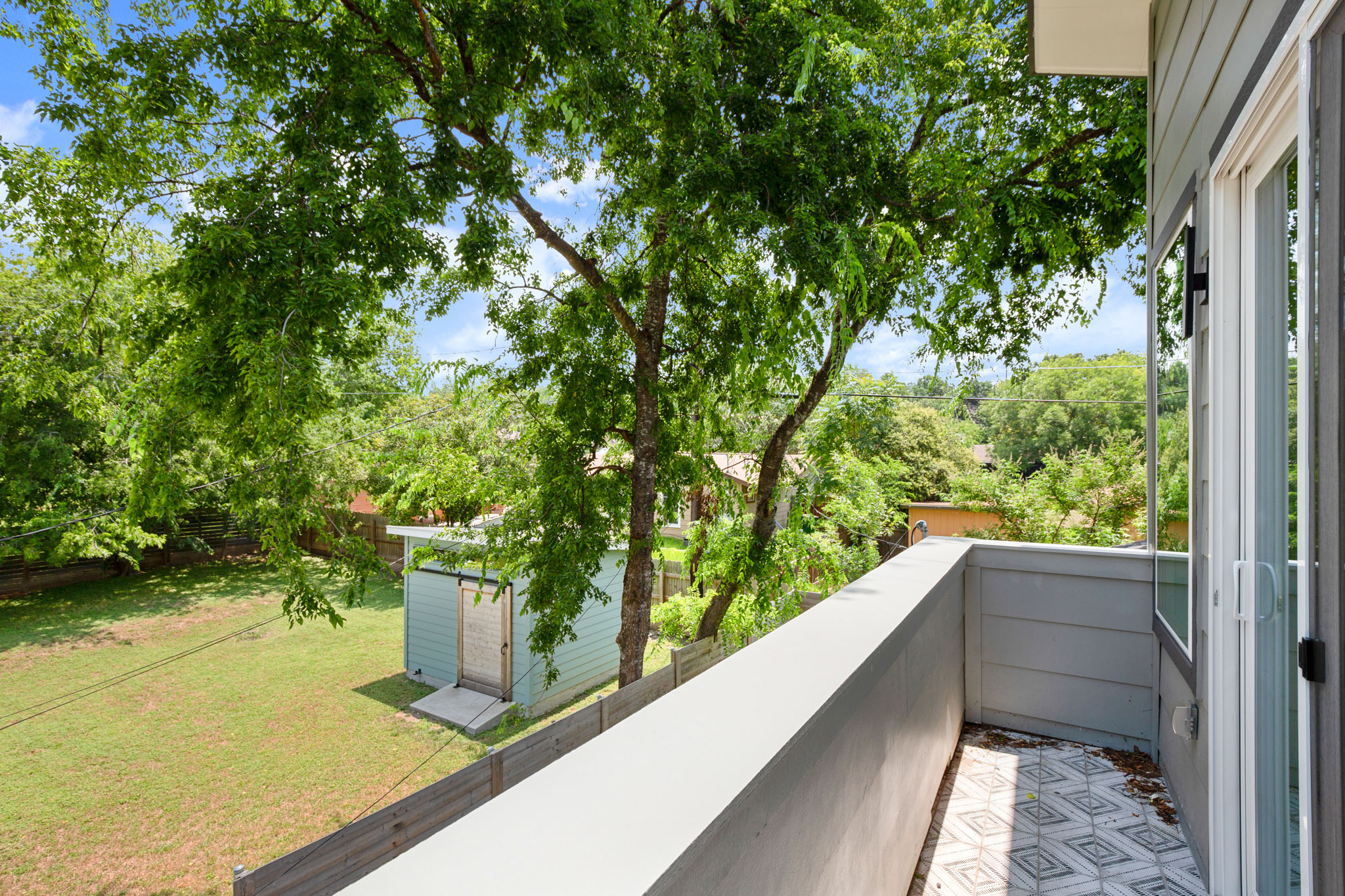 3003 Ray Wood Drive, Unit 2 Austin, TX 78704 - Photo 24 of 28 Balcony with view of wooded area
