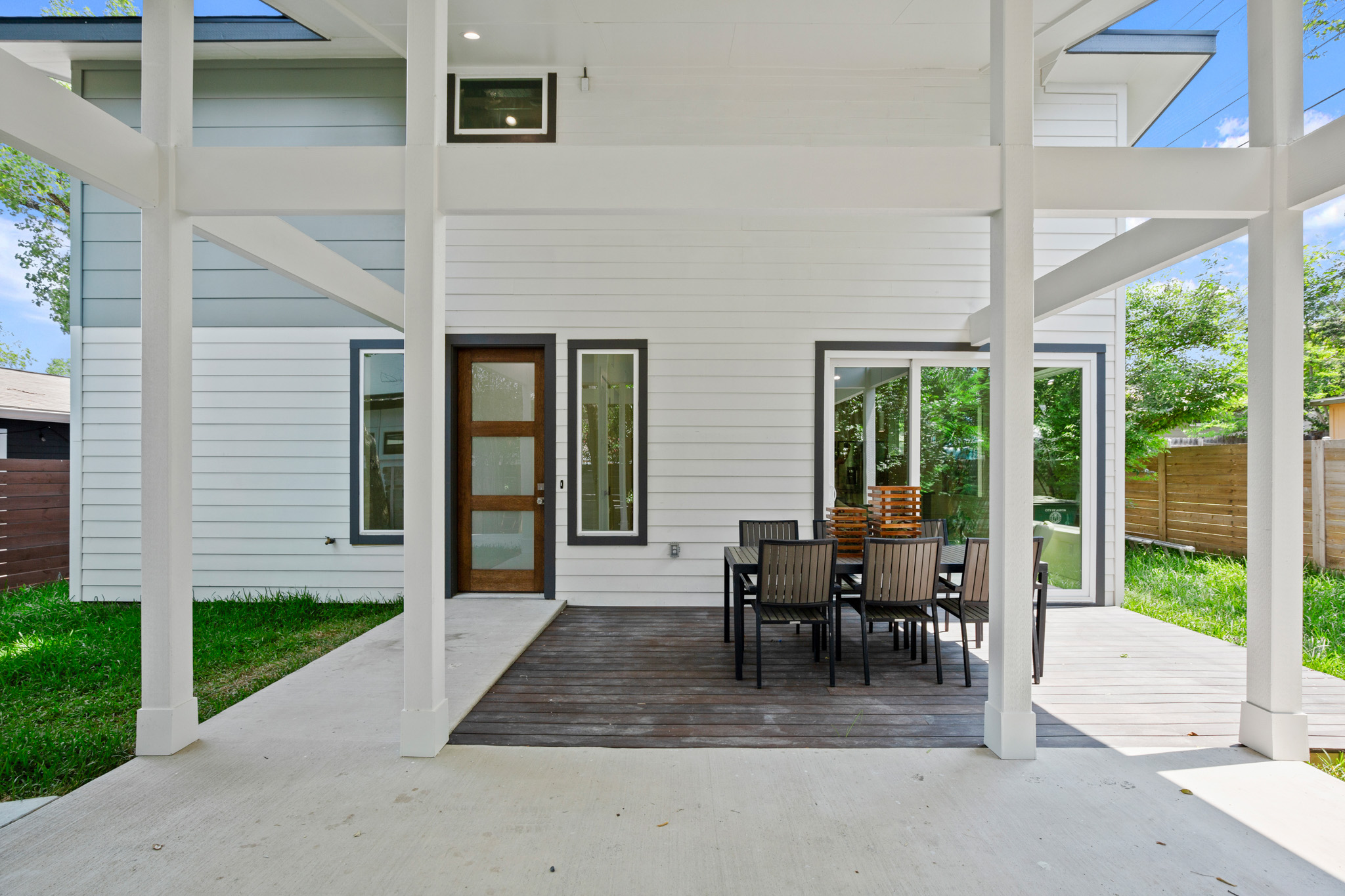 3003 Ray Wood Drive, Unit 2 Austin, TX 78704 - Photo 6 of 28 View of patio with outdoor dining space and a wooden deck